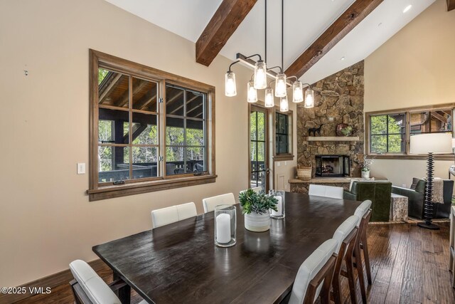 348 Red Draw, Edwards, CO 81632 - dining room with dark wood-type flooring, beam ceiling, a fireplace, high vaulted ceiling, and baseboards