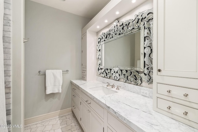 348 Red Draw, Edwards, CO 81632 - bathroom featuring marble finish floors, vanity, recessed lighting, and baseboards