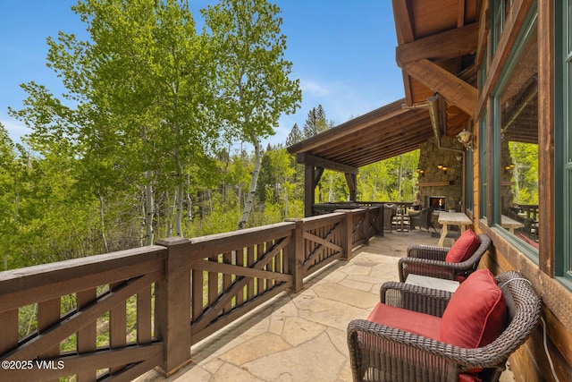 348 Red Draw, Edwards, CO 81632 - view of patio / terrace with an outdoor stone fireplace