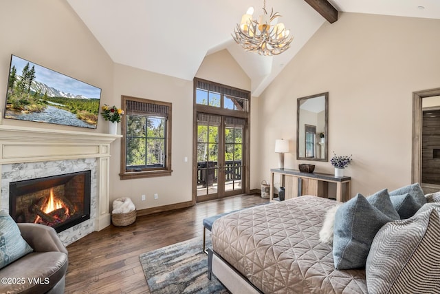 348 Red Draw, Edwards, CO 81632 - bedroom featuring access to outside, a chandelier, high vaulted ceiling, hardwood / wood-style flooring, and a premium fireplace