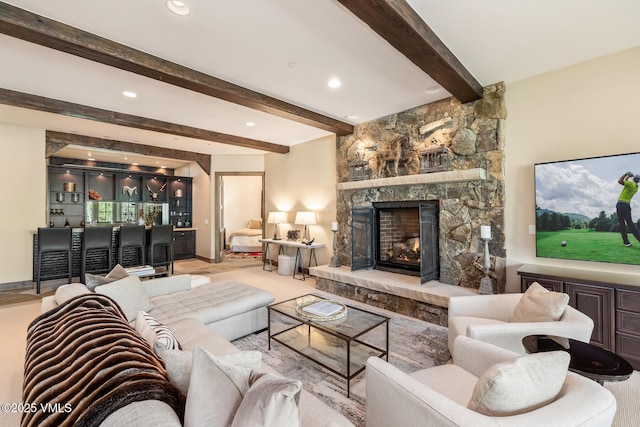 348 Red Draw, Edwards, CO 81632 - living room featuring beamed ceiling, a stone fireplace, recessed lighting, and bar