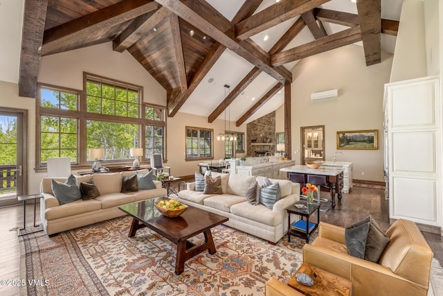 348 Red Draw, Edwards, CO 81632 - living room featuring high vaulted ceiling, wood-type flooring, beamed ceiling, baseboards, and healthy amount of natural light