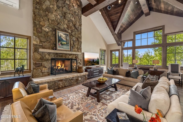 348 Red Draw, Edwards, CO 81632 - living room with wood finished floors, high vaulted ceiling, a wall mounted AC, beamed ceiling, and a fireplace