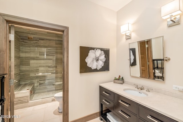 348 Red Draw, Edwards, CO 81632 - bathroom featuring vanity, toilet, a stall shower, and tile patterned floors