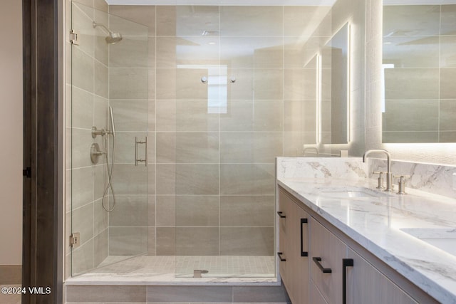 bathroom featuring vanity and an enclosed shower