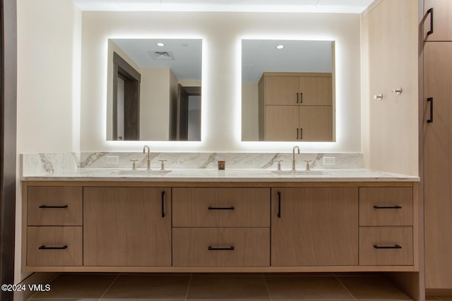 bathroom featuring vanity, tile patterned flooring, and decorative backsplash