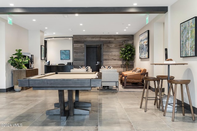 playroom with wooden walls and billiards