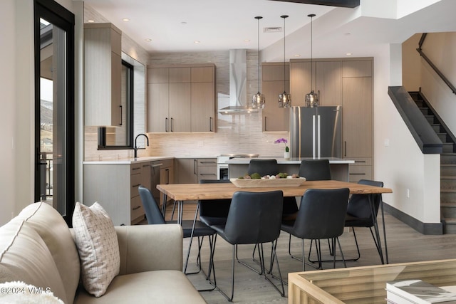 dining area featuring sink and hardwood / wood-style flooring