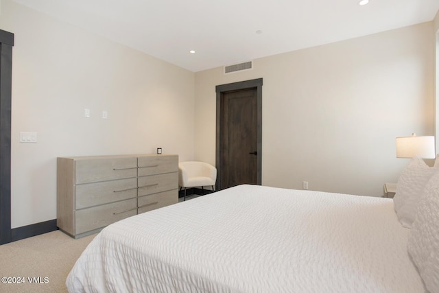 bedroom featuring light colored carpet