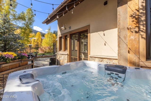 89 Trout Pond Ln, Avon, CO 81620 - view of home's exterior featuring stucco siding and a hot tub