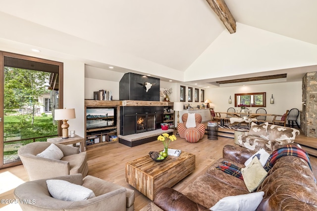 89 Trout Pond Ln, Avon, CO 81620 - living room with wood finished floors, beamed ceiling, a large fireplace, recessed lighting, and high vaulted ceiling