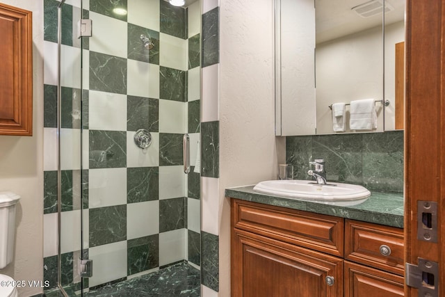 62 Highlands Ln Unit R103, R102, Beaver Creek, CO 81620 - full bathroom featuring a stall shower, tasteful backsplash, and vanity