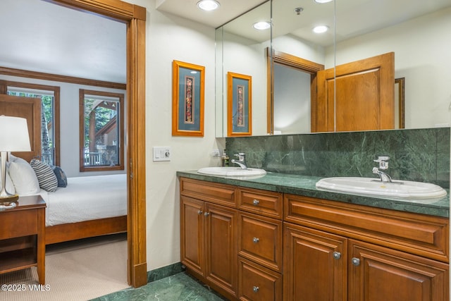62 Highlands Ln Unit R103, R102, Beaver Creek, CO 81620 - full bathroom featuring double vanity, decorative backsplash, and ensuite bathroom