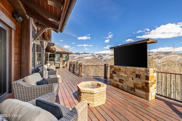 76 Elkhorn, Avon, CO 81620 - wooden deck with an outdoor fire pit and a mountain view