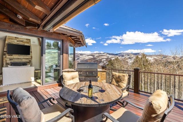 76 Elkhorn, Avon, CO 81620 - wooden terrace with outdoor dining space, area for grilling, and a mountain view