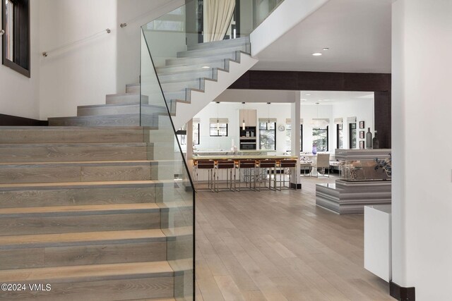 stairs featuring hardwood / wood-style flooring