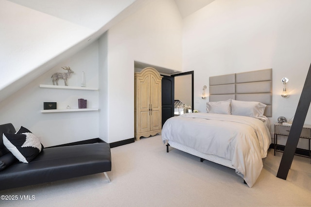 47 Woodviolet Rd, Avon, CO 81620 - bedroom featuring high vaulted ceiling, baseboards, and light carpet