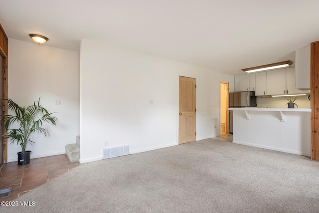 4255 Columbine Way Unit 16, Vail, CO 81657 - unfurnished living room with light carpet and baseboards