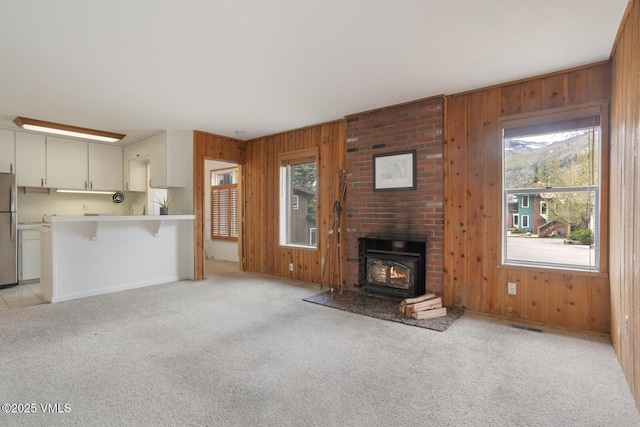 4255 Columbine Way Unit 16, Vail, CO 81657 - unfurnished living room featuring wooden walls and light colored carpet