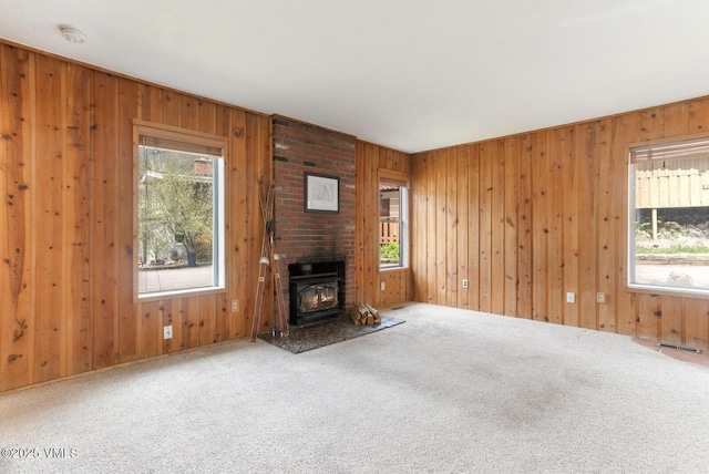 4255 Columbine Way Unit 16, Vail, CO 81657 - unfurnished living room with carpet floors, healthy amount of natural light, and wood walls