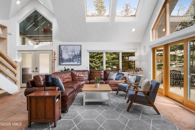 living room with recessed lighting, french doors, plenty of natural light, and high vaulted ceiling