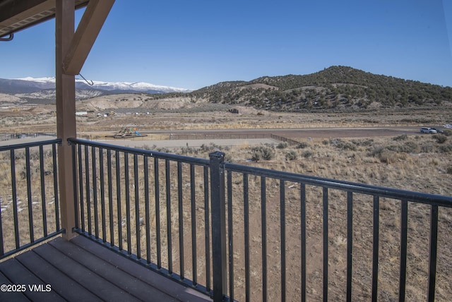 balcony featuring a mountain view