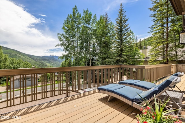 wooden deck featuring a mountain view