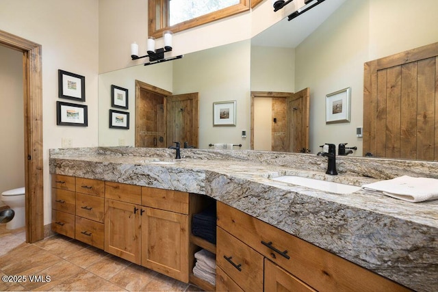 775 Potato Patch Dr Unit E, Vail, CO 81657 - full bath featuring double vanity, a high ceiling, and tile patterned flooring
