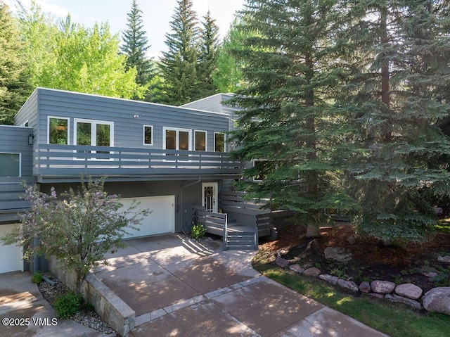 775 Potato Patch Dr Unit E, Vail, CO 81657 - view of front of house with driveway and an attached garage