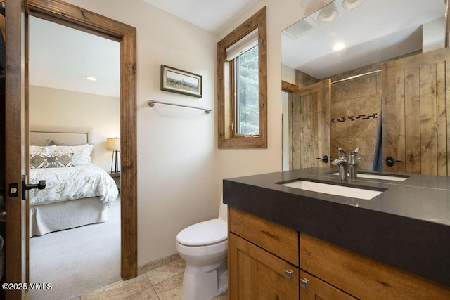 775 Potato Patch Dr Unit E, Vail, CO 81657 - ensuite bathroom with tiled shower, vanity, and tile patterned flooring
