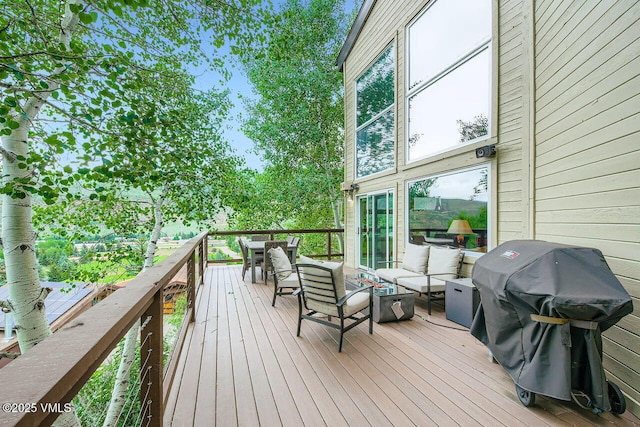 225 Daisy Ln Unit A, Eagle-Vail, CO 81620 - wooden deck with a grill and outdoor lounge area