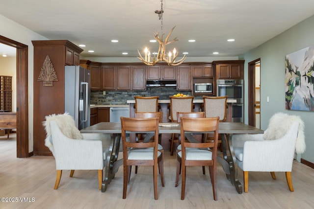 225 Daisy Ln Unit A, Eagle-Vail, CO 81620 - dining room featuring a chandelier, light wood-type flooring, and recessed lighting