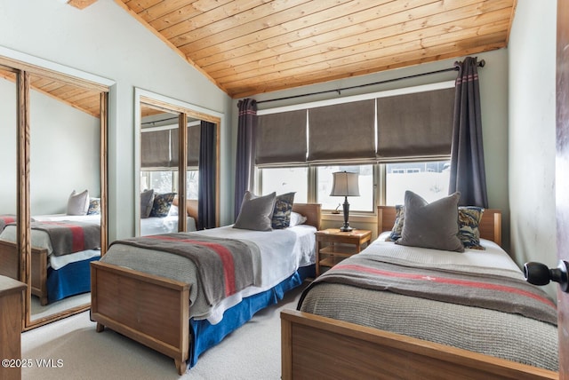 225 Daisy Ln Unit A, Eagle-Vail, CO 81620 - carpeted bedroom featuring wood ceiling, vaulted ceiling, multiple windows, and multiple closets