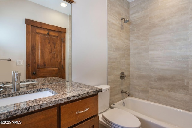 full bath featuring toilet, bathtub / shower combination, and vanity