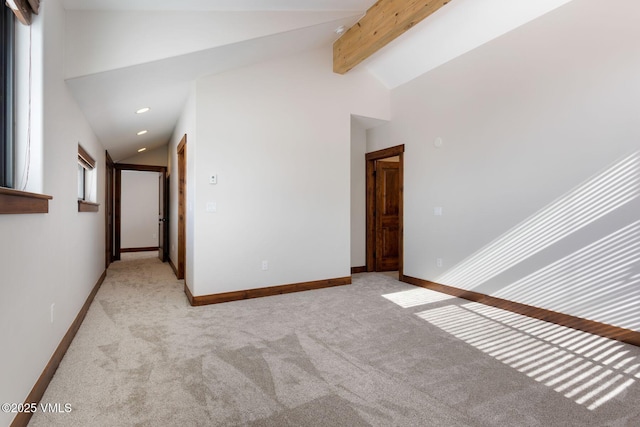 unfurnished room with recessed lighting, baseboards, beamed ceiling, and light colored carpet