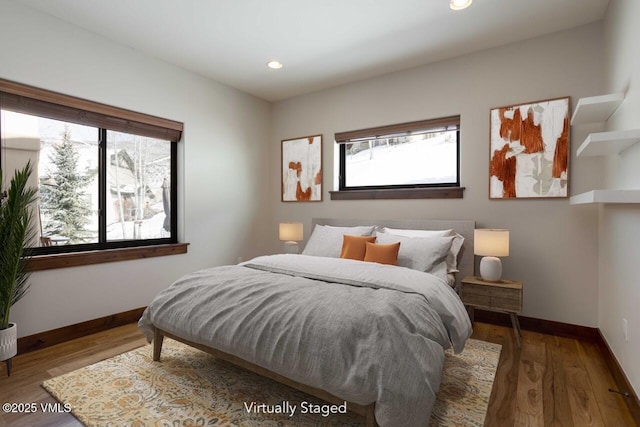 bedroom featuring recessed lighting, baseboards, and wood finished floors