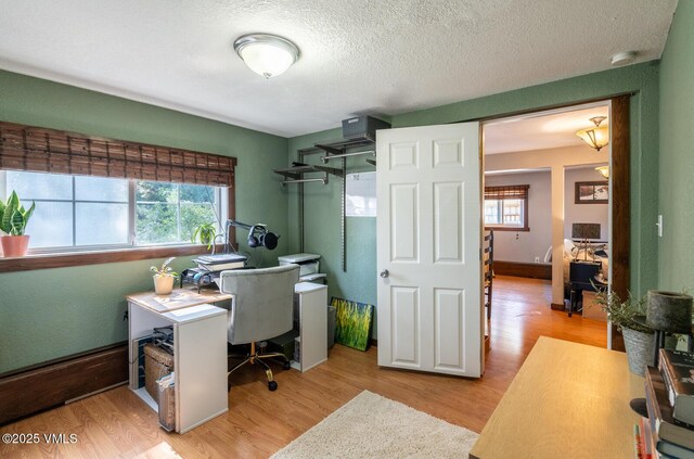 636 Valley Rd, Gypsum, CO 81637 - office with plenty of natural light, light wood finished floors, and a textured ceiling