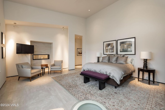 bedroom featuring a towering ceiling