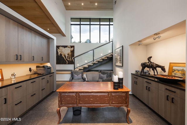 home office with a towering ceiling