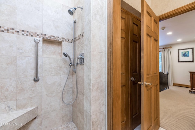 bathroom with tiled shower