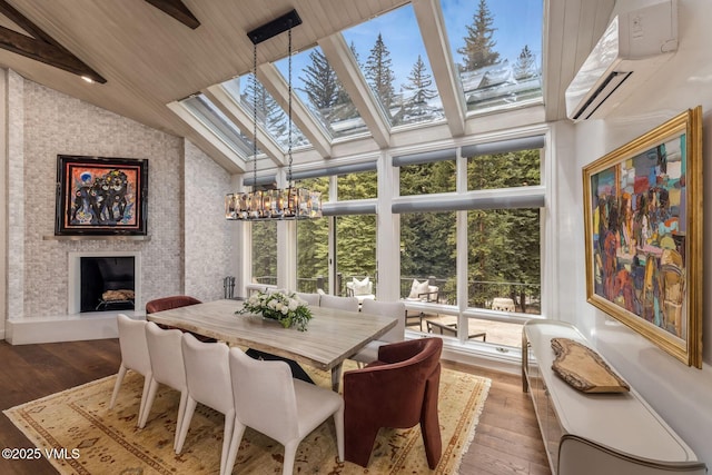 1531 Lake Creek Rd, Edwards, CO 81632 - sunroom featuring an AC wall unit, a chandelier, and a skylight