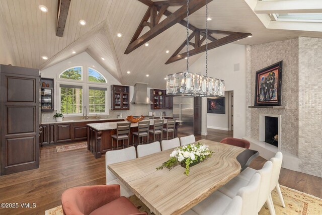 1531 Lake Creek Rd, Edwards, CO 81632 - dining space featuring dark wood-type flooring, a fireplace, high vaulted ceiling, and recessed lighting