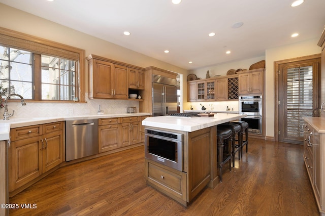 273 Bearden Rd, Edwards, CO 81632 - kitchen with a center island, a sink, appliances with stainless steel finishes, dark wood finished floors, and recessed lighting