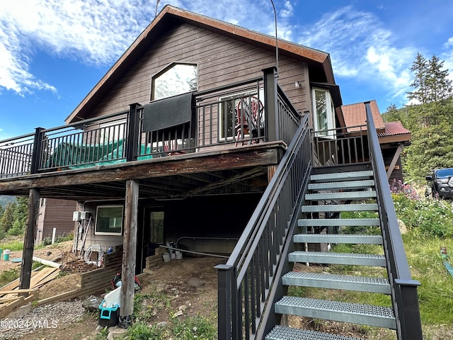 back of property with a deck