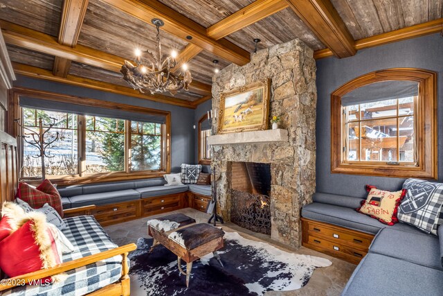 living room featuring a notable chandelier, wooden ceiling, a fireplace, and beam ceiling