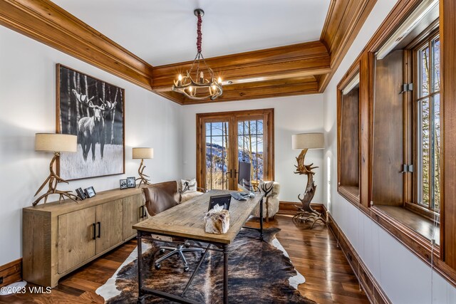 home office with dark wood-type flooring, ornamental molding, a chandelier, and french doors