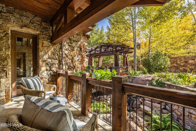 wooden terrace with a pergola