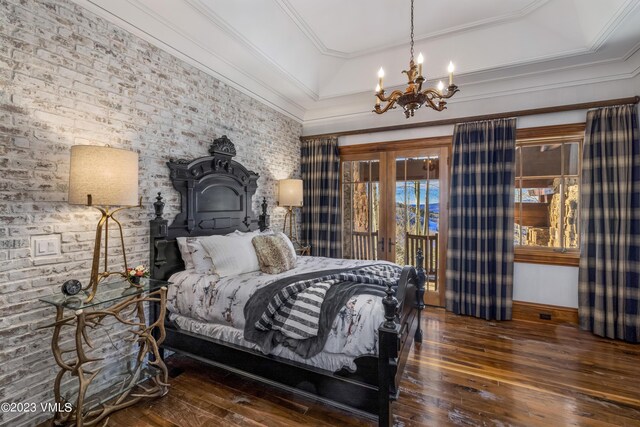 bedroom featuring ornamental molding, dark hardwood / wood-style floors, an inviting chandelier, and french doors