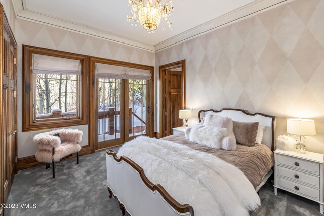 bedroom with a notable chandelier, crown molding, access to outside, and dark colored carpet