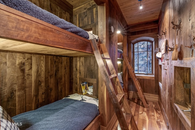 interior space featuring wood ceiling, wood-type flooring, and wood walls